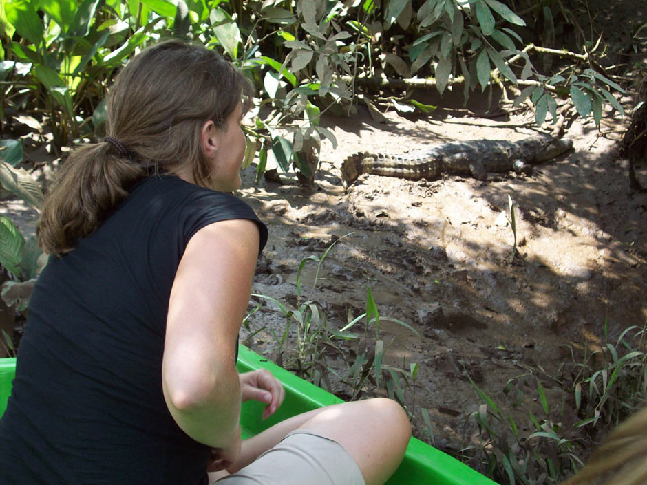 That’s me checking out a caiman (like a crocodile) on a Costa Rica riverbank. The boat driver drifted just a little closer than this, and then the caiman jumped into the water (causing me to jump about a mile, too!).